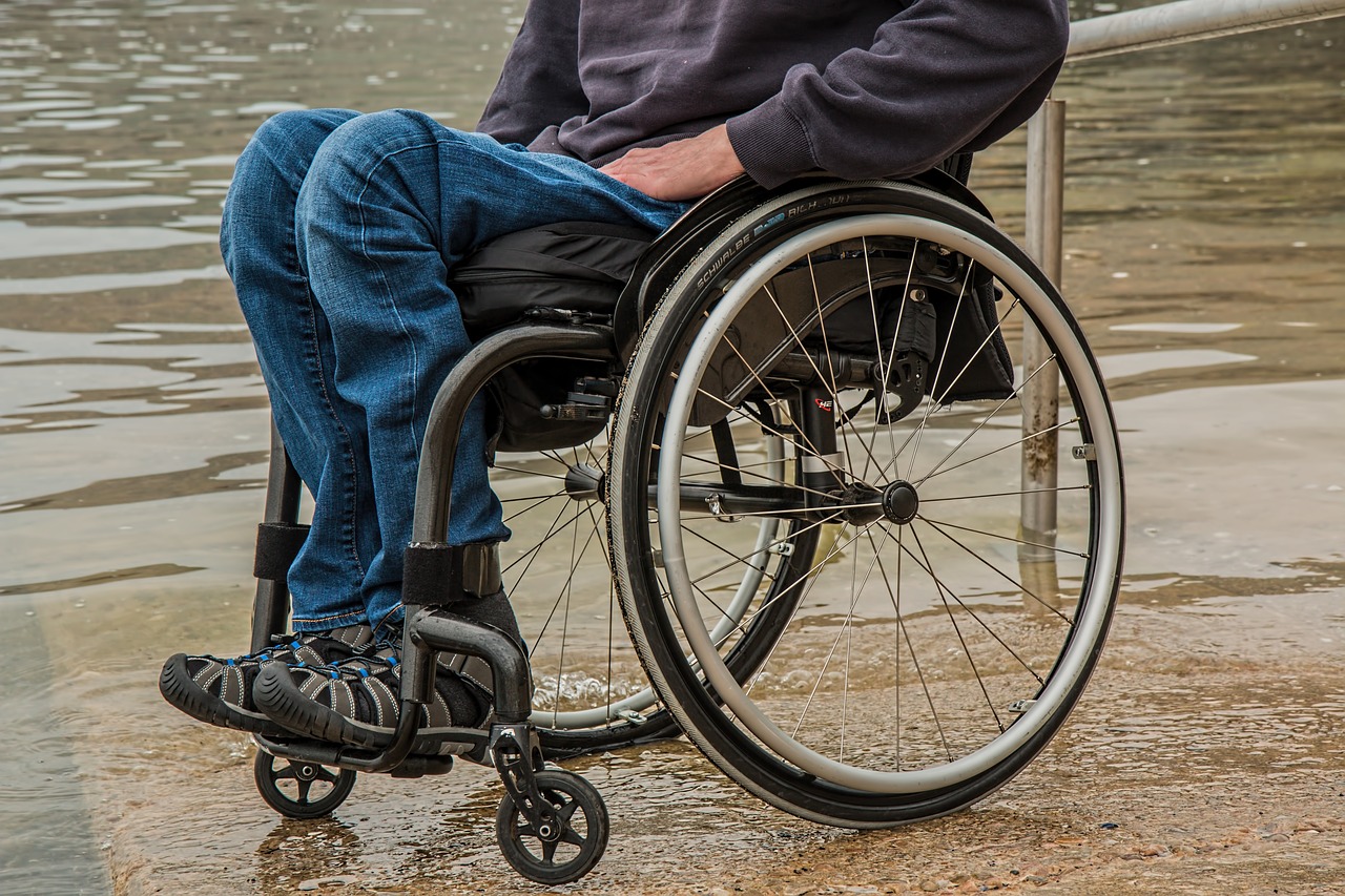 Therapist helping a client who uses a wheelchair